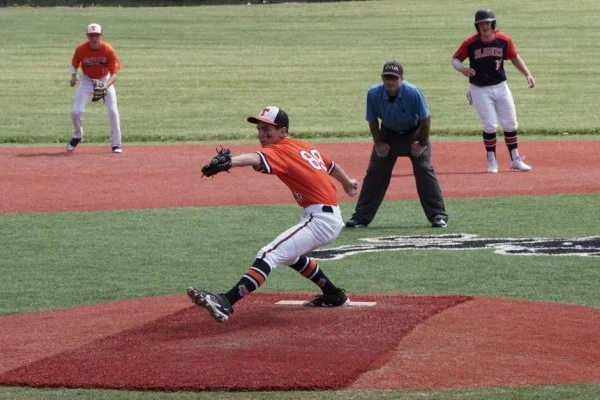 baseball pitcher throwing ball